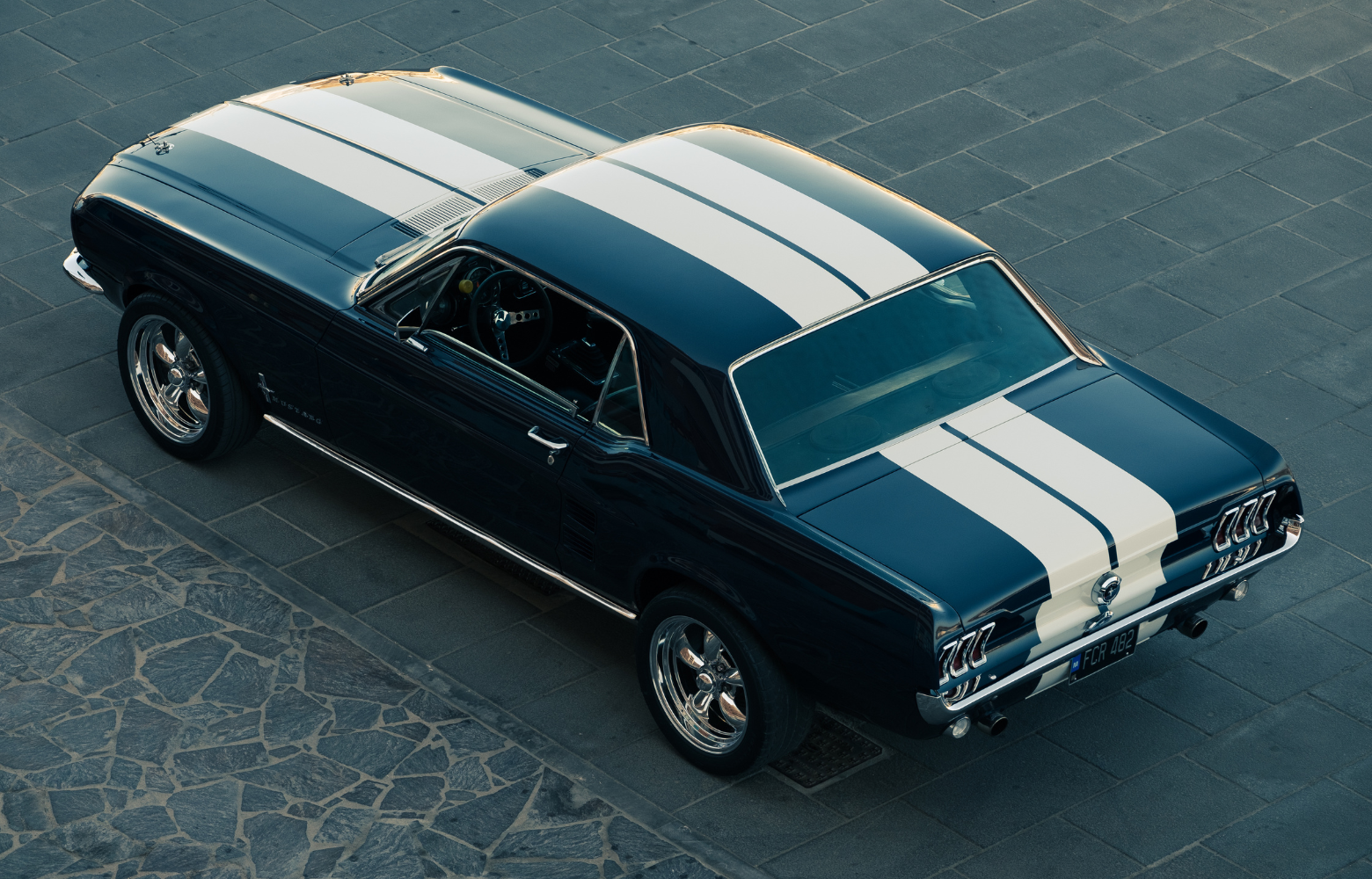 A classic car on display, showcasing its vintage design and timeless automotive craftsmanship at the Cavanaugh Carriages Car Show.