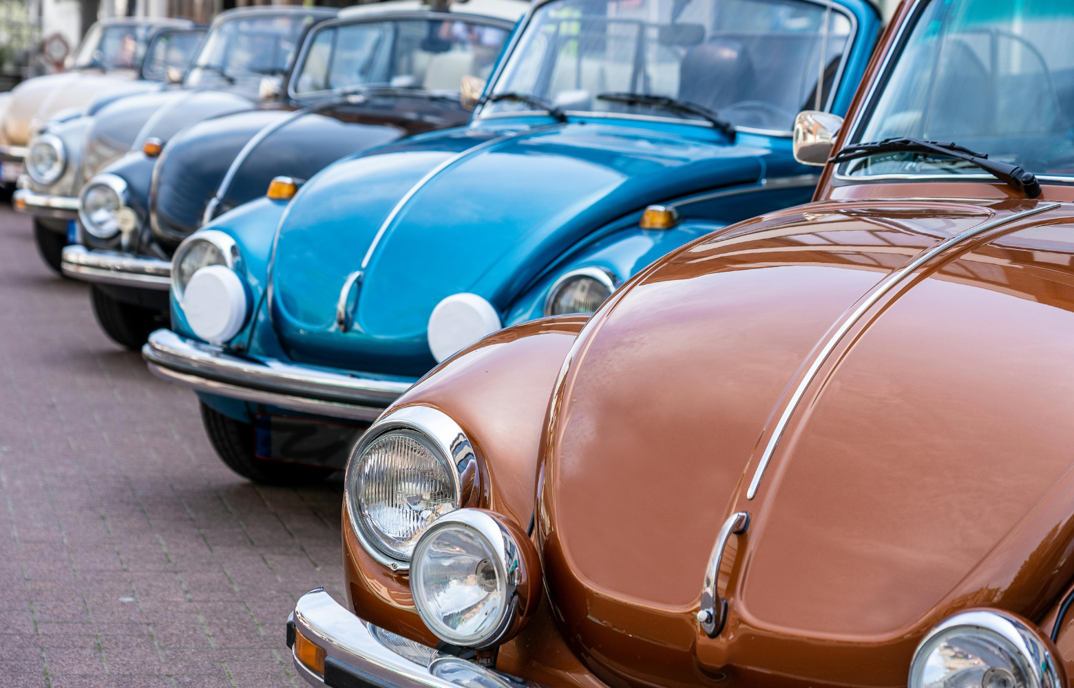A classic car on display, showcasing its vintage design and timeless automotive craftsmanship at the Cavanaugh Carriages Car Show.