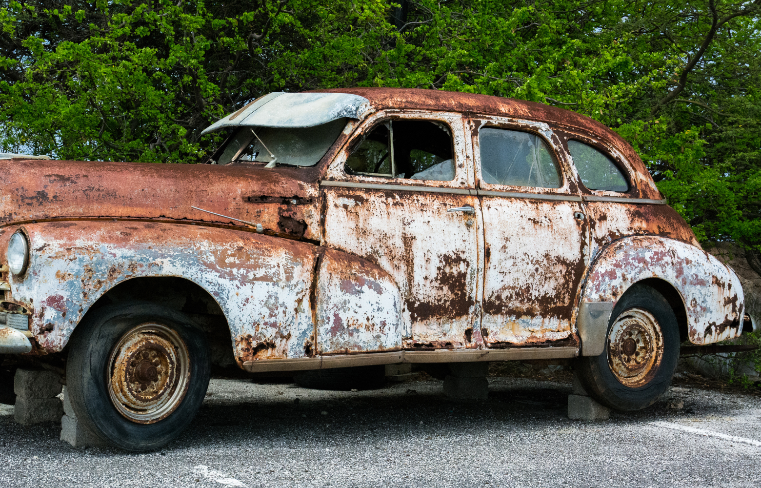A classic car on display, showcasing its vintage design and timeless automotive craftsmanship at the Cavanaugh Carriages Car Show.