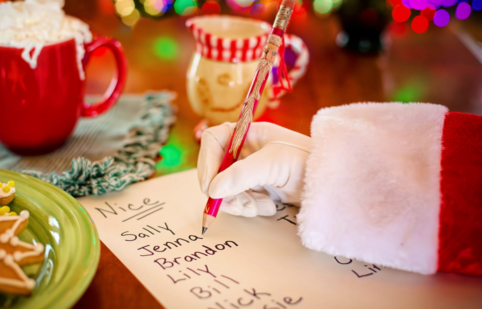 Santa holding his iconic naughty and nice list, checking it twice