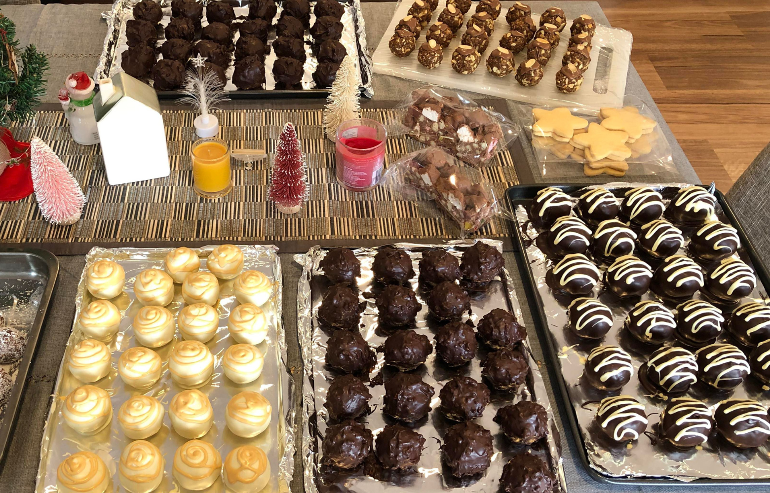 An assortment of festive holiday treats arranged on a table, featuring cookies, candies, and seasonal delights ready to be enjoyed.