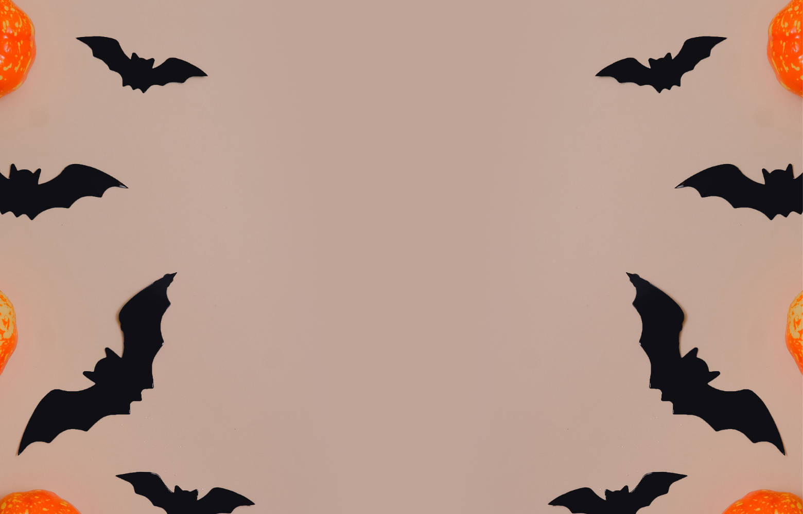 A stylized graphic featuring bats and pumpkins, representing the spooky and festive theme of Halloween haunted hay rides.