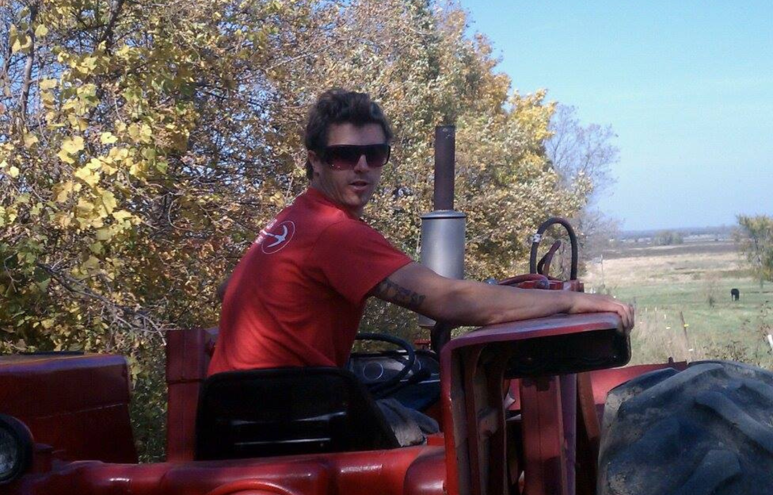 Cody Cavanaugh skillfully driving the tractor that leads the hay ride at Cavanaugh Carriages in Neenah, WI, adding a personal touch to the experience.