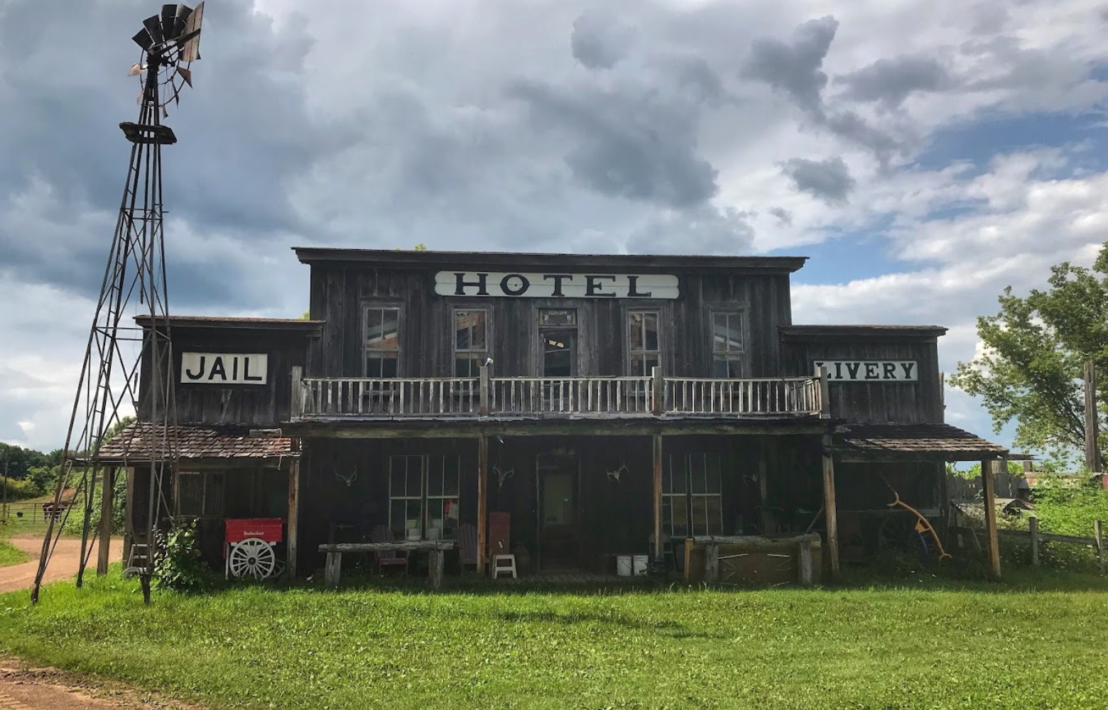 A themed building by Cavanaugh Carriages designed to resemble an old-fashioned hotel, jail, and livery, showcasing rustic charm and historical flair